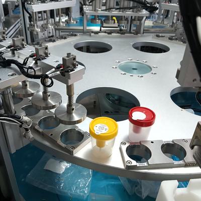 টার্নটেবিল-স্টাইল ইউরিন কাপ সমাবেশ মেশিন যা স্থিতিশীল পারফরম্যান্স এবং কম রক্ষণাবেক্ষণ ব্যয় সহ মেডিকেল পণ্য সমাবেশের জন্য